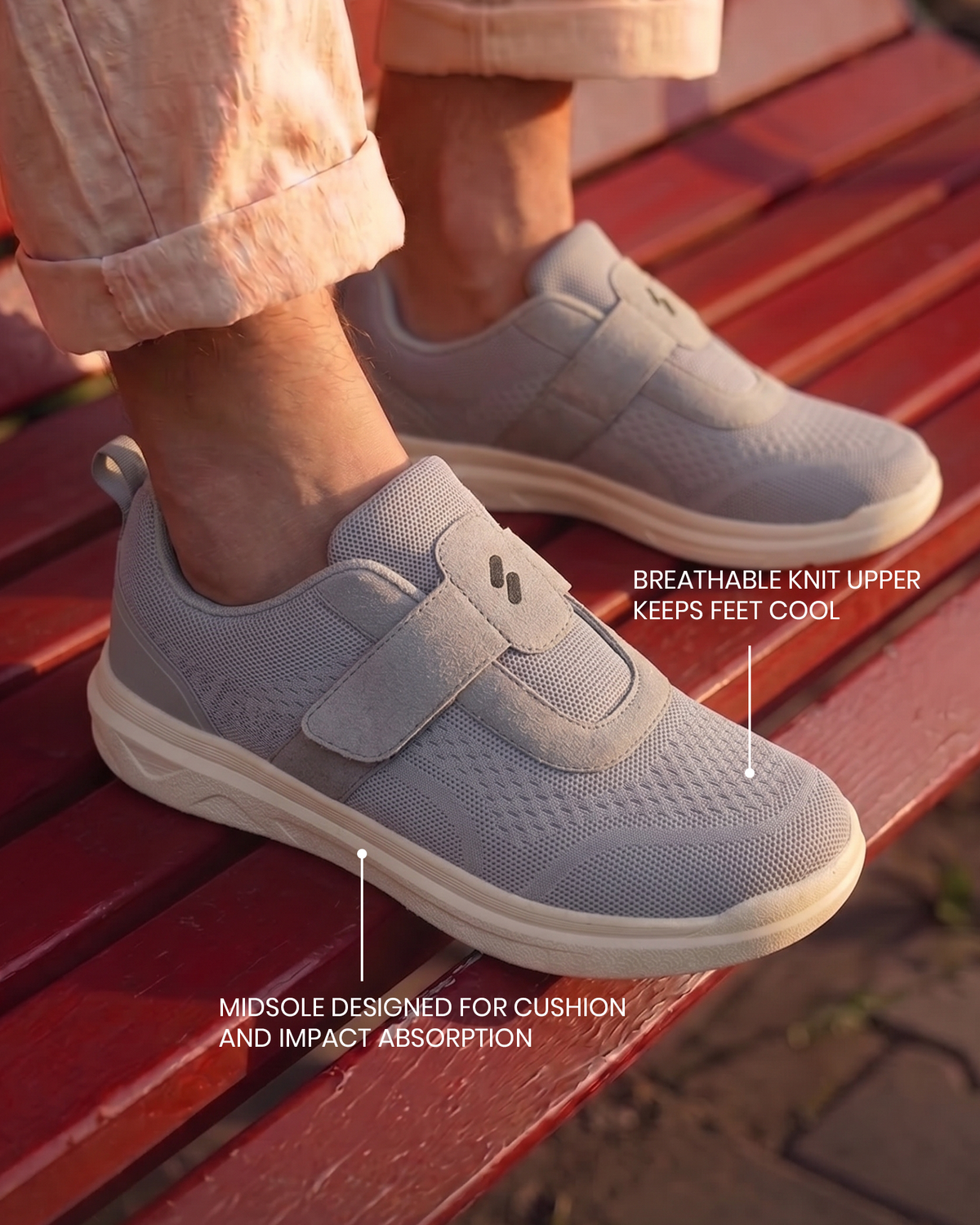 Feet wearing Silwer Ease Castle Grey Men's Shoes on a wooden bench outdoors, with callouts for the breathable knit upper and cushioned midsole