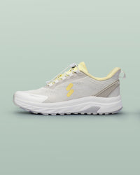 Silwer Active Lime White Men's Shoe, side profile showing the lightning bolt logo, on a green background