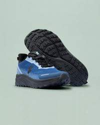 Silwer Active Ink Blue Men's Shoe tipped on its side, showing the black treaded outsole