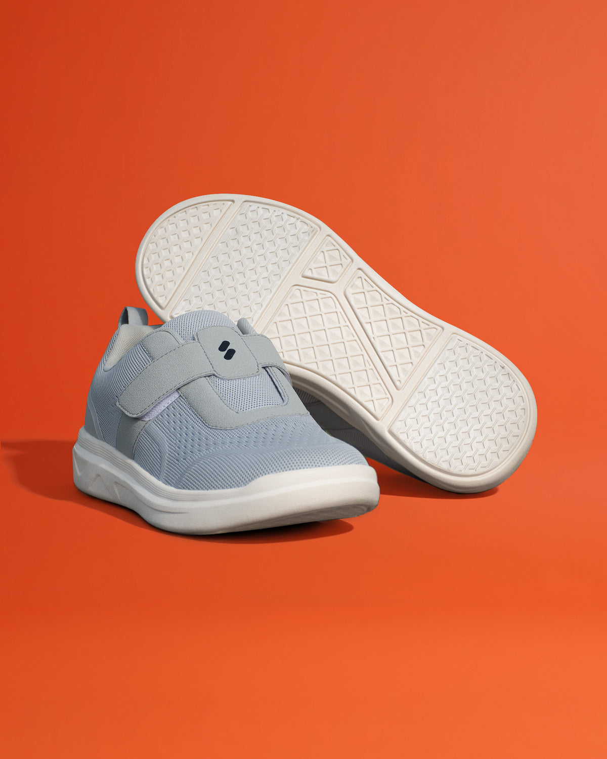 Pair of Silwer Ease Castle Grey Men's Shoes, one upright and one turned to show the textured outsole